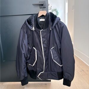 This medium-sized Coach winter coat, in a stylish blue.